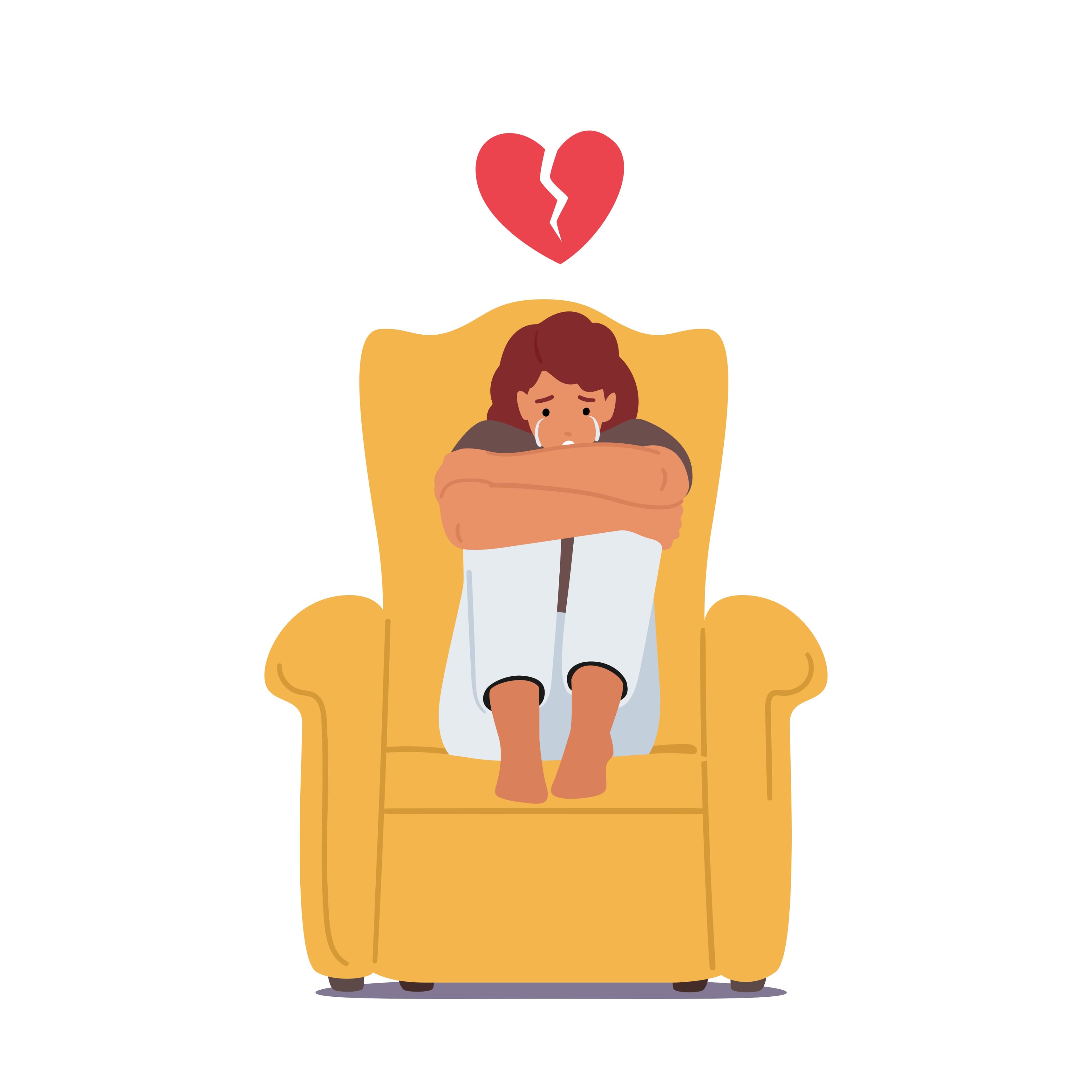 A girl crying on a chair with a broken heart